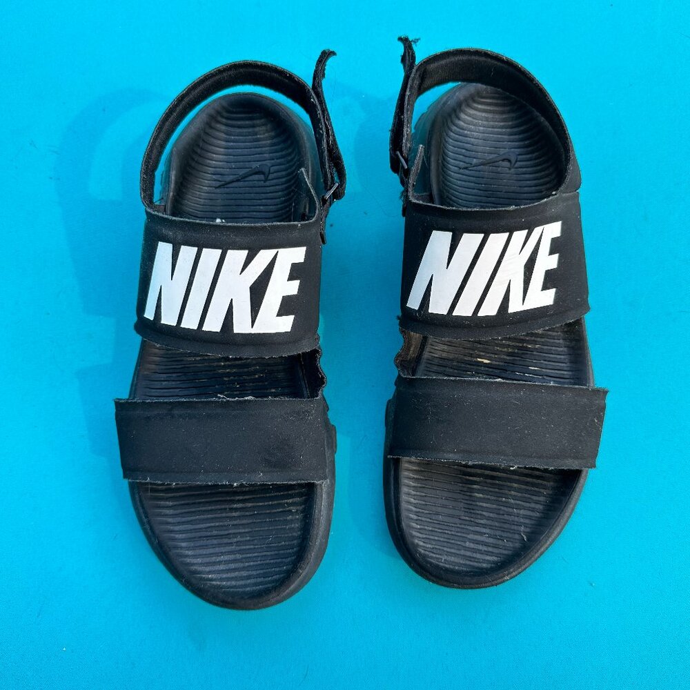 Women's black Nike strap sandals, size 7